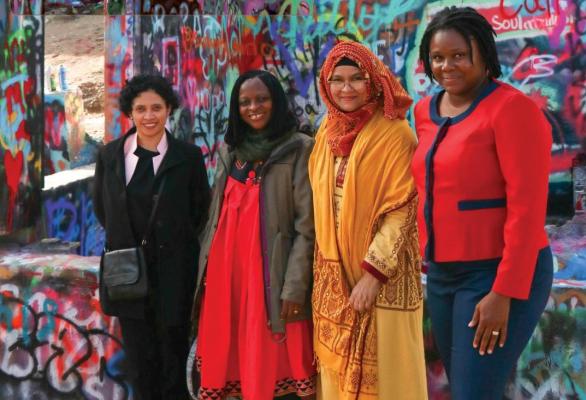 2025 OWSD-ELSEVIER Award Winners Women in a line against a wall of graffiti