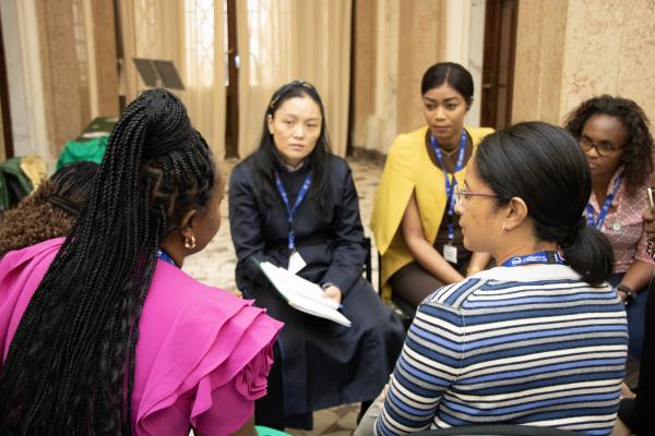 EC fellows at the 2025 workshop in Trieste, Italy Women in a discussion group